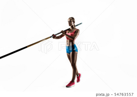 Female pole vaulter training on white studio background Female pole vaulter training on white studio background 54763557