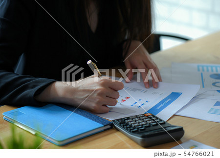 Female executives are finalizing a budget plan. Female executives are finalizing a budget plan. 54766021