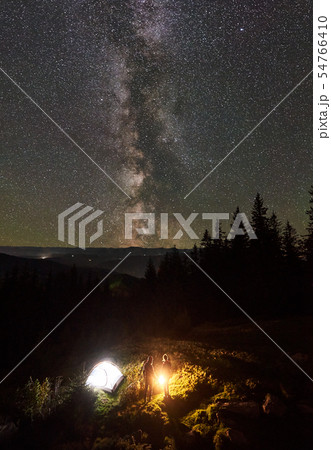Night summer camping in the mountains under night starry sky Night summer camping in the mountains under night starry sky 54766410