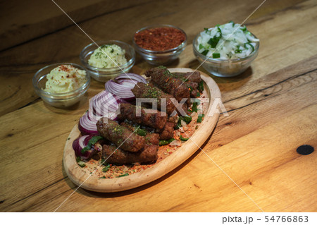 Classic kebabs on the plate. 54766863