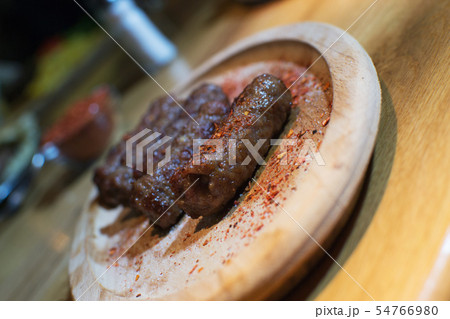 Classic kebabs on the plate. 54766980