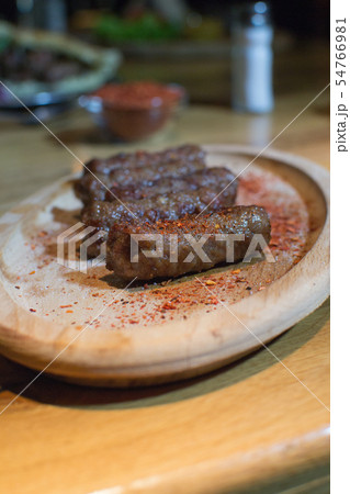 Classic kebabs on the plate. 54766981