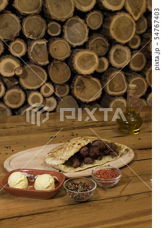 Classic kebabs on the plate. 54767403