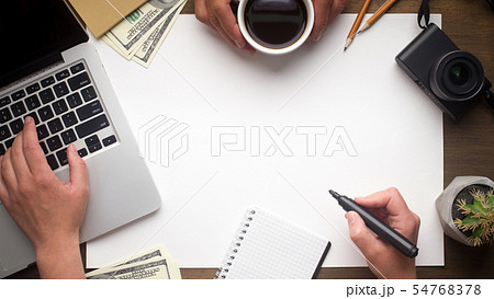 Woman hand looking for something on laptop and holding marker 54768378