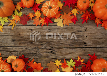 Autumn leaves on wooden background Autumn leaves on wooden background 54769445