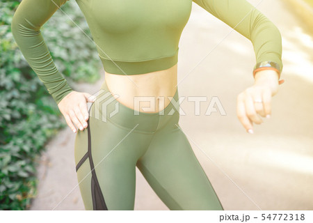 Close-up athletic female body slim elegant waist of a stylish fitness model with perfect figure 54772318