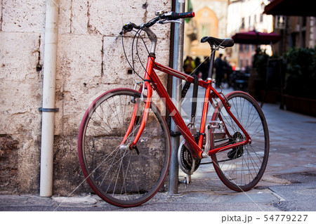 Parked bicycle at the beautiful streets of Pisa 54779227