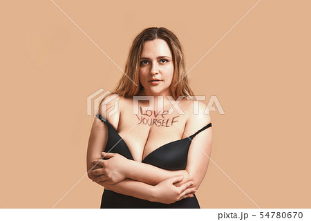 I love myself Happy plus size sexy model in black lingerie with writen text love yourself on her I love myself Happy plus size sexy model in black lingerie with writen text love yourself on her 54780670