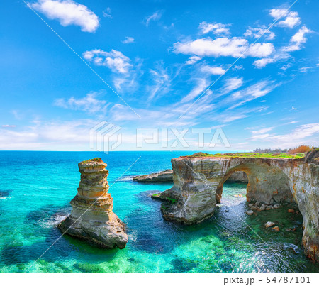 Picturesque seascape with cliffs, rocky arch at Picturesque seascape with cliffs, rocky arch at 54787101