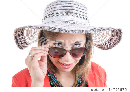 young woman with a hat and sunglasses young woman with a hat and sunglasses 54792676