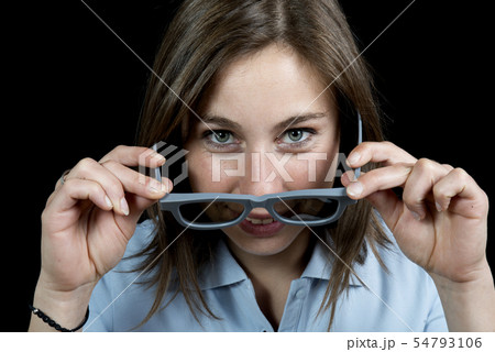 young woman with a pair of 3d glasses young woman with a pair of 3d glasses 54793106