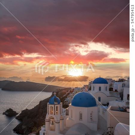 Oia village against sunset on Santorini in Greece Oia village against sunset on Santorini in Greece 54795413