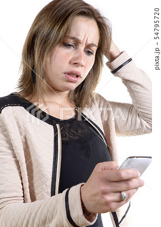 young woman with a problem on the phone young woman with a problem on the phone 54795720