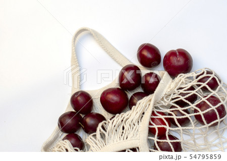 Plums in an ecological cotton reusable string bag, Plums in an ecological cotton reusable string bag, 54795859