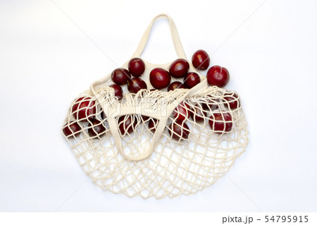 Plums in an ecological cotton reusable string bag, Plums in an ecological cotton reusable string bag, 54795915