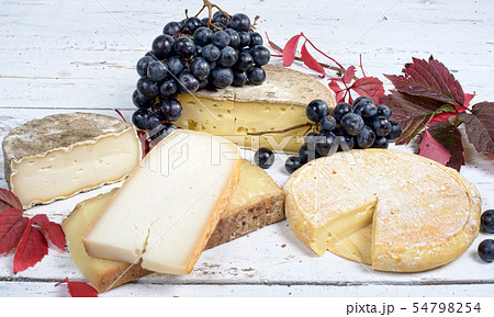 French cheeses with white and black grapes 54798254
