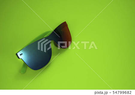 Modern colorful sunglasses on yellow background 54799682