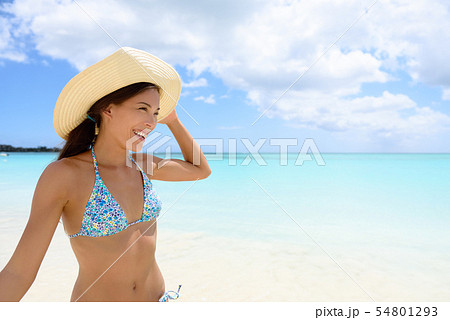 Woman in hat on the beach - girl having fun in sun 54801293