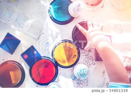 boy is having fun while playing with stamps boy is having fun while playing with stamps 54801339