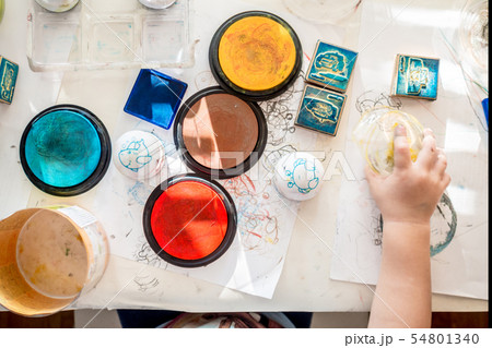 boy is having fun playing with tempera paints boy is having fun playing with tempera paints 54801340