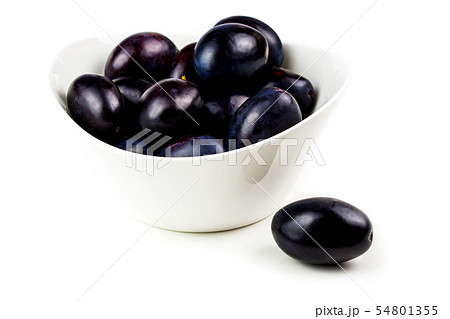 tasty plums in ceramic bowl 54801355