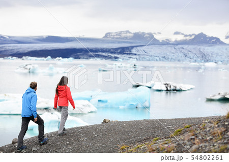 Hiking couple on Iceland Jokulsarlon glacier lake 54802261