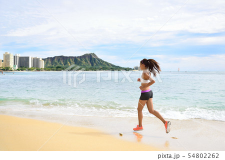 Woman runner - running fitness girl beach jogging Woman runner - running fitness girl beach jogging 54802262