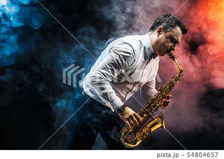 Handsome adult man playing saxophone Handsome adult man playing saxophone 54804657