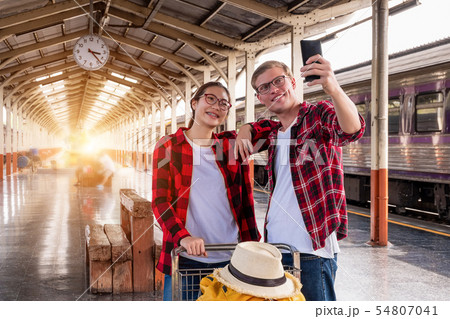 Happy young couple travellers together on vacation 54807041