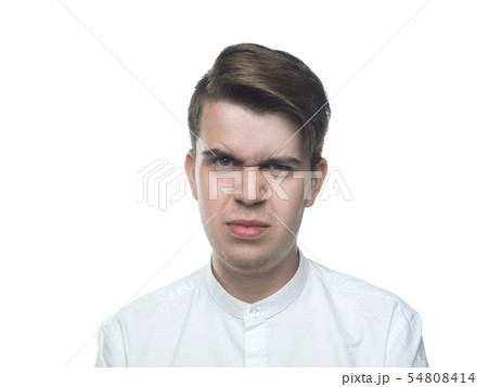Portrait of a young man. Disgust. Bad smell. Isolated on white background Portrait of a young man. Disgust. Bad smell. Isolated on white background 54808414