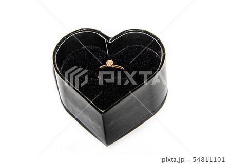 Beautiful shiny engagement ring with diamond in heart shape velvet box isolated on white background 54811101