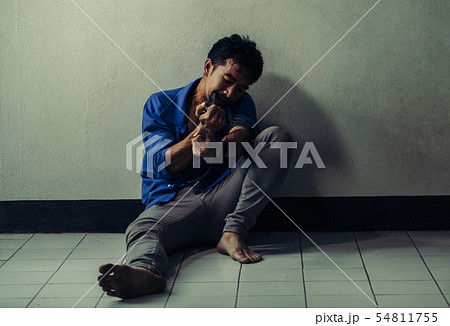 Asian man suffering from drugs. 54811755