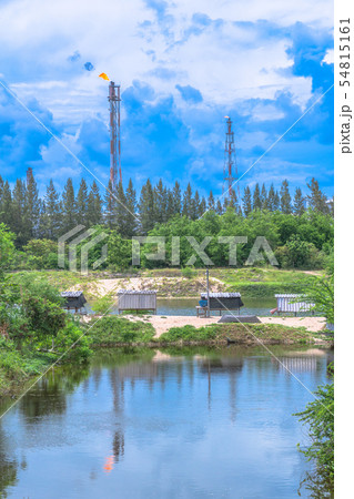 Chimney of the oil refinery in blue sky 54815161