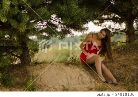 young woman in red dress nature fresh air 54818136