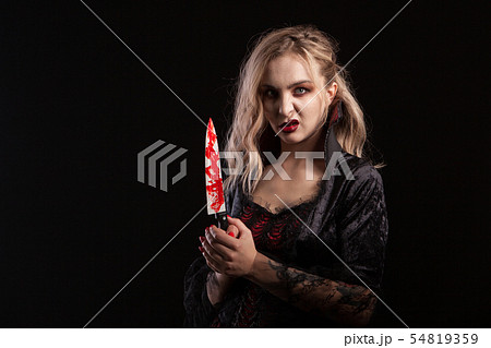 Portrait of beautiful and seductive boody vampire woman for hallooween Portrait of beautiful and seductive boody vampire woman for hallooween 54819359