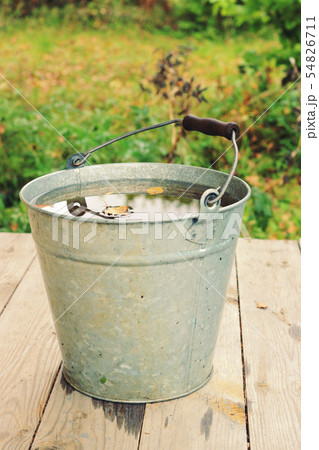 Rainy water in the bucket 54826711
