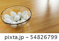 Eggs in Glass Bowl on Wooden Table Floor 54826799