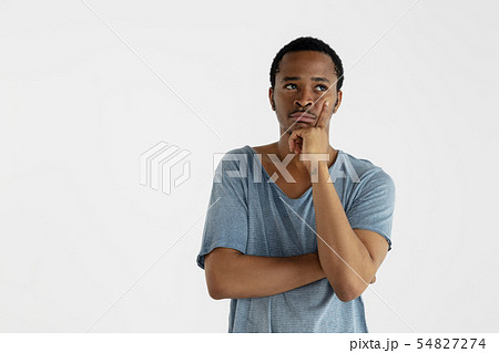 Portrait of young man isolated on white studio background Portrait of young man isolated on white studio background 54827274