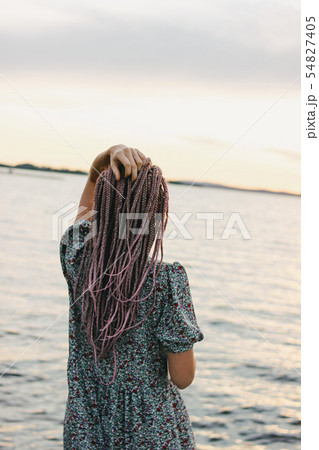 Beautiful romantic young woman with african braids 54827405