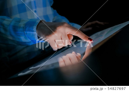 Woman using multimedia touchscreen display of interactive kiosk Woman using multimedia touchscreen display of interactive kiosk 54827697