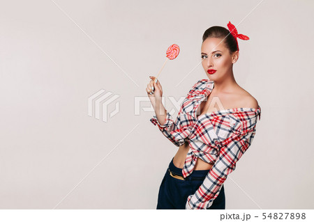 beautiful pin-up woman with lollipop. 54827898