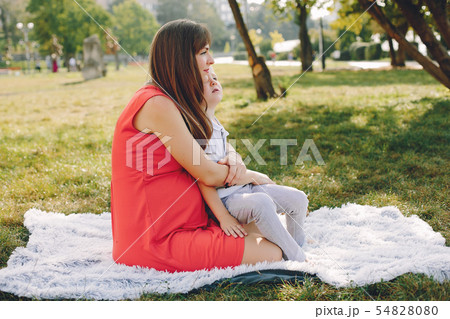 Mother with son playing in a summer park Mother with son playing in a summer park 54828080