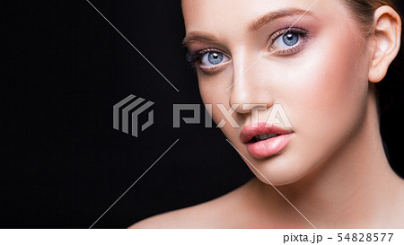 Fashion studio shot of beautiful young woman with make-up. Close-up portrait. Cosmmetology, beauty 54828577