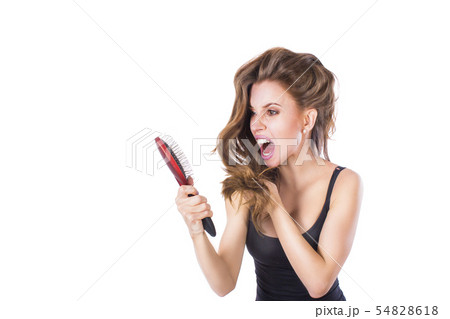 Young beautiful girl having problems while hair. Isolated studio shot Young beautiful girl having problems while hair. Isolated studio shot 54828618
