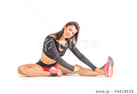 pretty brunette in white active wear on white background. pretty brunette in white active wear on white background. 54828638