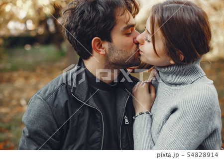 Beautiful couple spend time in a summer city Beautiful couple spend time in a summer city 54828914