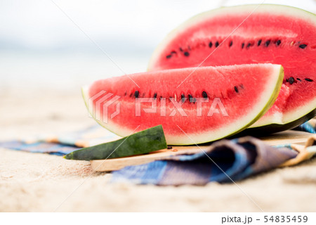 Summer picnic time on a beach. Fresh water melon Summer picnic time on a beach. Fresh water melon 54835459