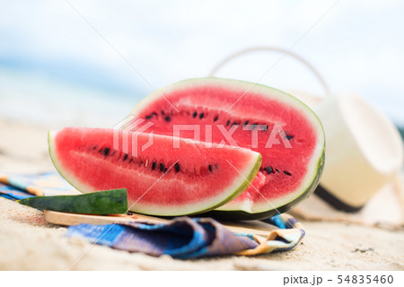 Summer picnic time on a beach. Fresh water melon Summer picnic time on a beach. Fresh water melon 54835460
