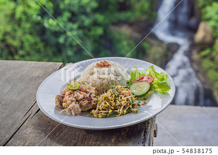 Indonesian food, tuna and rice in a cafe on the background of a waterfall Indonesian food, tuna and rice in a cafe on the background of a waterfall 54838175