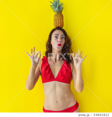 Young brunette woman in red bathing suit have fun Young brunette woman in red bathing suit have fun 54842812